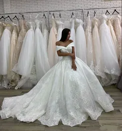 New Arrival Elegant Ball Gown Wedding Dresses Off Shoulder Lace Appliques Beaded Cap Sleeves Court Train Button Back Puffy Bridal Gowns