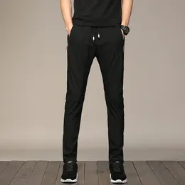 2020 Nya Mäns Casual Byxor Sommardesigner Solid Färg Plus Storlek 38 Slim Stretch Byxor Män Slim Fit Sweat Grå Blå Svart