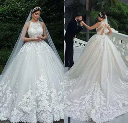 Luxury Lace Ball Gown Wedding Dresses 2020 Buttons Covered Back Appliques Tulle Long Train Bridal Wedding Gowns Arabic Robe De Mariee