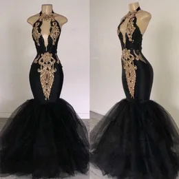 Seksowne 2019 Mermaid Prom Dresses Afryki Złote Aplikacje Keyhole Bez Rękawów Tulle Pageant Arabski Dubai Formalne Długie Party Suknie Wieczorowe Suknia