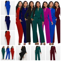 Europeiska våren och hösten ny fast färg Turtleneck Stand Collar Long Sleeve Pocket Belt Jumpsuit. Stöd blandat parti