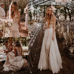 Favoloso pizzo Boho Backless Abiti da sposa Una linea Profondo scollo a V Beach Abiti da sposa Tulle Lunghezza pavimento Bohemian vestido de novia