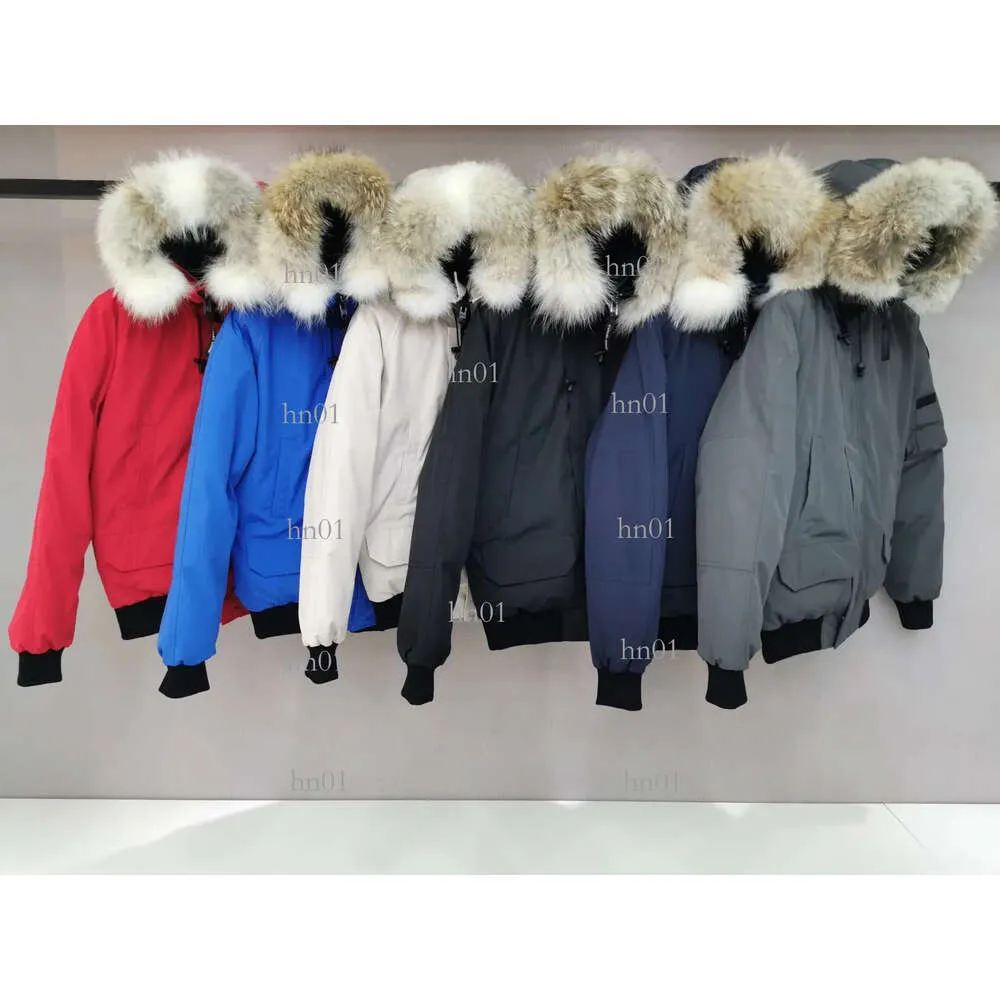 Hombres Bomber Down Jacke Real Wolf Fur Parkas de lona con capucha Leer Pach Cremallera Pockes Cálido Grueso Ouwear Diseñador Mujeres Ruff 686