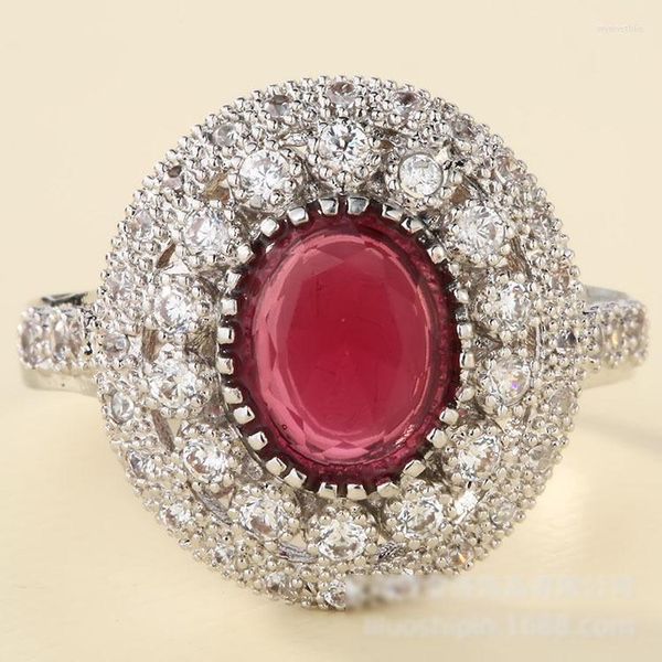 Anillos de boda Gorgeous Female Oval Red Zircon Stone Anillo de compromiso para mujeres Luxury Micro Pave White Color Crystal Weddding Jewelry Wynn22