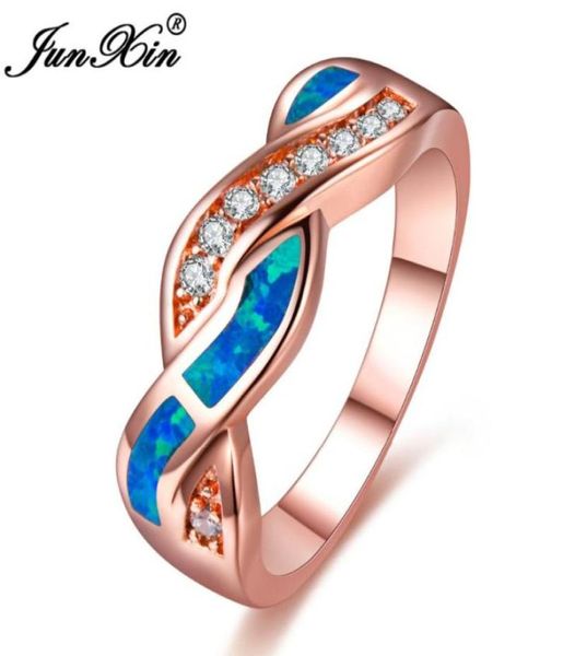 Anillos de boda JUNXIN Gorgeous Rose Gold Filled Crossed para mujeres Zircon Ocean BlueWhite Fire Opal Ring Regalos de Navidad4533330