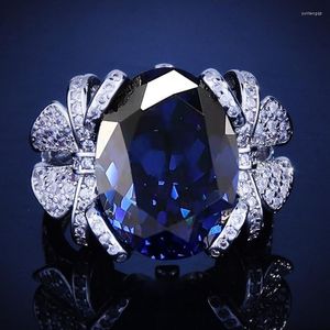 Anillos de boda Gran corte ovalado Azul Zafiro CZ Piedra para hombres Mujeres Encantador Banquete Fiesta Joyería Banda