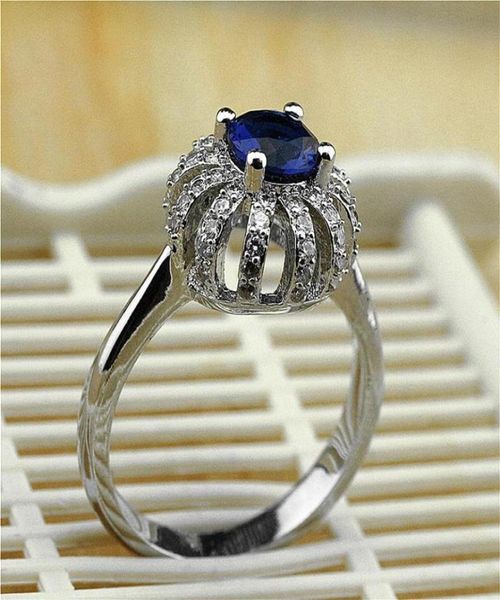 Anneaux de mariage Luxury Cross Line Silver Color Zirconia Crown Anneau pour les femmes 039 Party Zircon Blue Crystal Romantic Jewelry8636196