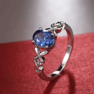 Wedding Rings Romantische solitaire blauwe ovale cz ring voor vrouwen met chique cross -touwontwerp trouwdag feestje mode sieraden