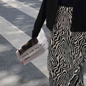 WERUERUYU Femmes Zebra Imprimer Jupe tricotée Coupe droite Taille élastique Dos Split Longueur Midi Vintage Dames Tenues 210708