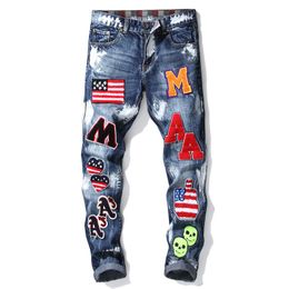 West Coast hip hop Hommes Imprimé Denim Stretch Jeans Streetwear Caractère Crâne Pleins Flamme Peint Pantalon Vintage Boutons Fly Slim Pantalon Déchiré