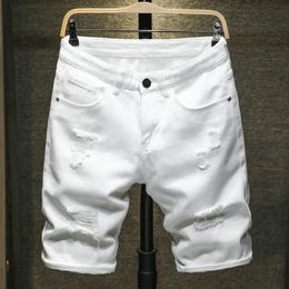 Jeans blanc shorts hommes entraves trou effiloché le genou classique classique mode simple décontracté short denim mâle de haute qualité 240416