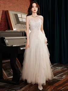 Witte prom jurk elegante feestjurken avond in spaghetti veterlijvere vloer lengte tule met pailletten