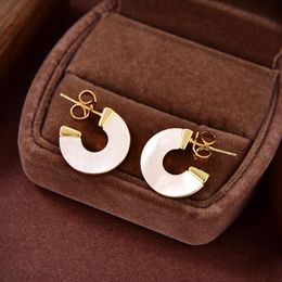 Coquille blanche femme dames boucles d'oreilles Stud Western Queen planète étoile aura haute qualité bijoux de luxe femmes Saturn boucle d'oreille concepteur bijoux cadeaux ER560