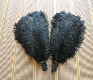 entier 100pcslot autruche plumes plumes d'autruche plume noir pour la pièce maîtresse de mariage décor de mariage coetumes fête décor2663647