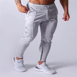 Whole-MarchWind Diseñador Pantalones de jogging Hombres Pantalones deportivos Pantalones de correr Hombres Joggers Pantalones de chándal de algodón Pantalones ajustados Culturismo 290O