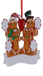 Famille de pain d'épice en résine entière de 4 ornements de Noël avec des pommes rouges comme cadeaux personnalisés pour les vacances5882733