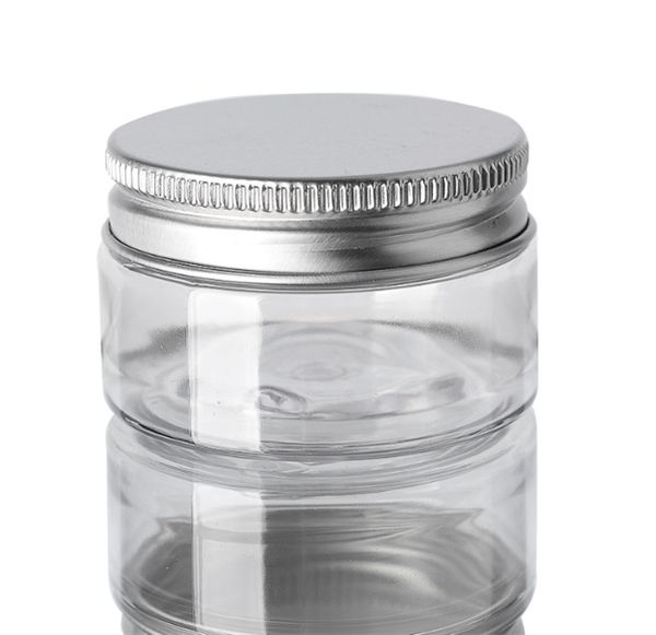 Venta al por mayor 30 45 50 60 80 ml Frascos de plástico Cajas de latas de almacenamiento de PET transparentes Botella redonda con tapas de plástico / aluminio JL8856