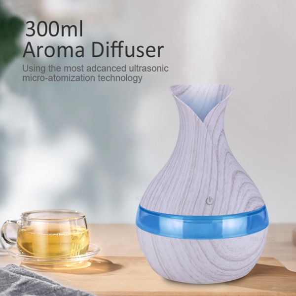 Venta al por mayor 300 ml Difusor de aroma Aceite esencial Ultrasónico Aire Humidificador USB Purificador Forma de grano de madera 7 colores Cambio de luces LED para oficina en casa