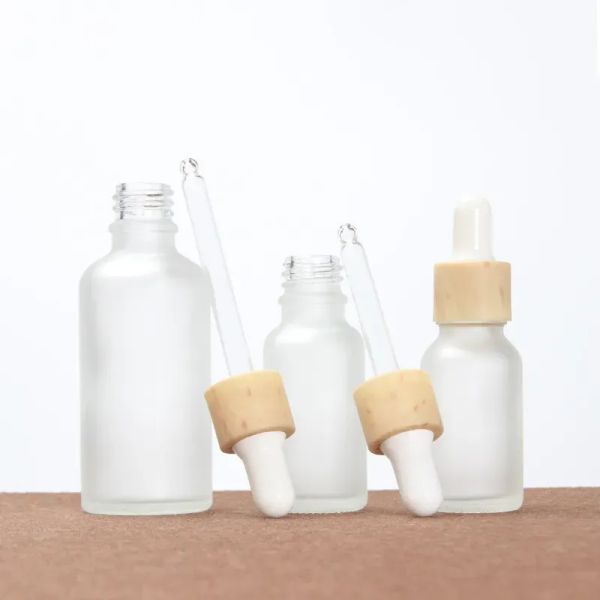 Botella de gotera de vidrio helado de 30 ml al por mayor con tapa de bambú para aceites esenciales cosméticos y aromaterapia zz