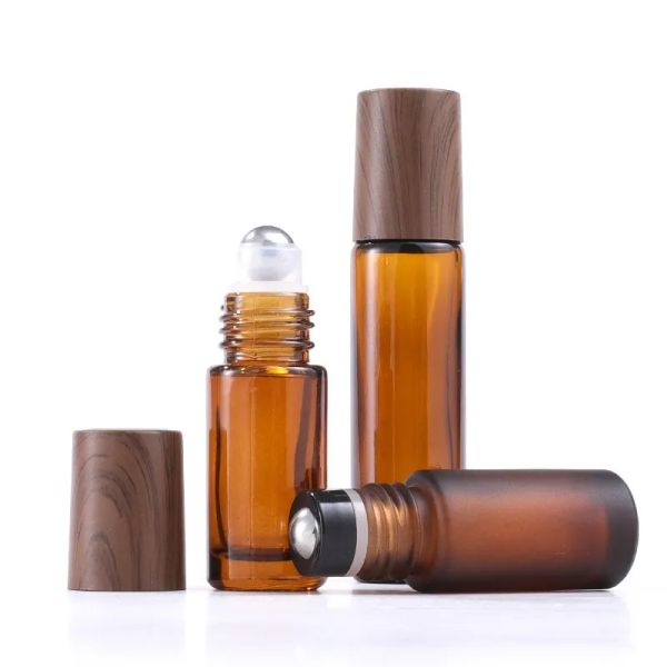 wholesale 5 ml 10 ml 15 ml Botellas Rollon de vidrio ámbar Tapa de plástico de grano de madera Botella de perfume de aceite esencial esmerilado con acero inoxidable ZZ