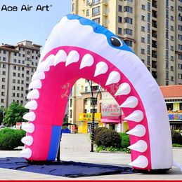 Vente en gros 5 MW x 5mh (16,5x16,5 pieds) avec souffleuse festival personnalisé entrée décorative arc modèle de bouche de requin gonflable pour les événements de fête et la publicité