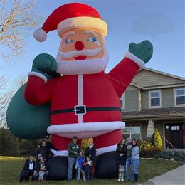 wholesale Père Noël gonflable géant de Noël 10 mH (33 pieds) Décoration extérieure de Père Noël gonflable pour les décorations de Noël de fête de cour avec le bateau libre de ventilateur