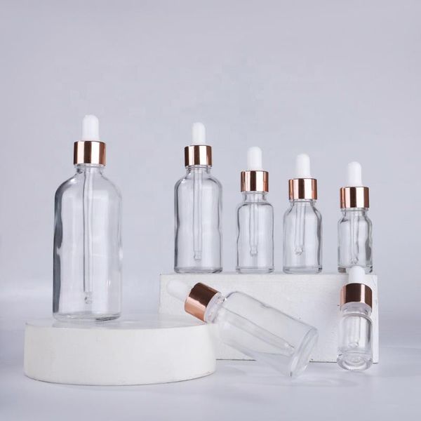 Botellas cuentagotas de vidrio de suero transparente al por mayor 5 ml 10 ml 15 ml 20 ml 30 ml 50 ml 100 ml con tapa de oro rosa para ZZ