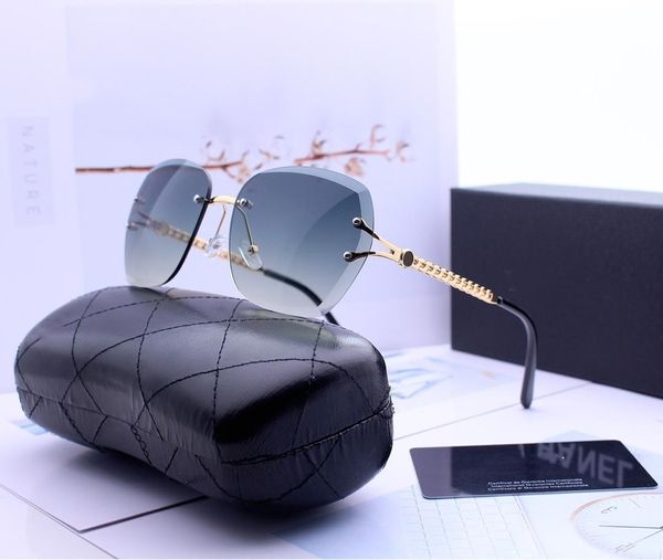 Gafas de sol diseñadas al por mayor: las damas conducen gafas de sol laterales con marco grande de alta definición y lentes de resina polaroid hd modelo 0002