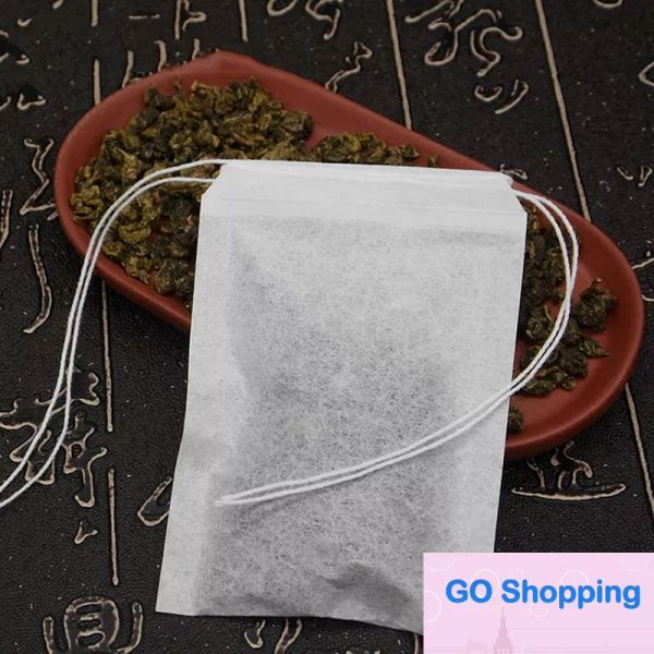 Venta al por mayor de herramientas de juego de té desechables 100 piezas 60X90mm bolsas de filtro de papel vacías con hilo de doble cordón bolsas de embalaje de plantas de hierbas limpias