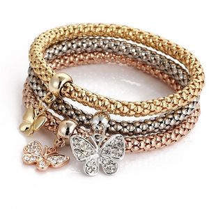 Venta al por mayor Pulsera de cristal elástico Diamante Corazón Corona Árbol de la vida Cráneo Mariposa Pulseras con dijes Brazalete Conjuntos Joyas voluntad y arena 3pcs / set