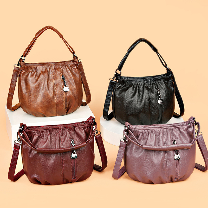 Wholesale factory ladies leather shoulder bags simple atmosphere solid color Joker handbags sewing retro bucket bag zipper decorative fashion mother handbag 8001