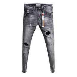 Groothandel mode casual tieners cowboy Koreaanse trendy knie gescheurde gat skinny jeans rauw rand rand mode stretch broek t200614