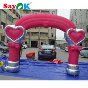 Al por mayor -Giant Pink Pink Inflable Wedding Arch Arcade With Heart Party Events Decoration Show