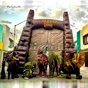 wholesale La puerta del parque jurásico simulada del arco inflable enorme explota la puerta del dinosaurio para el evento al aire libre