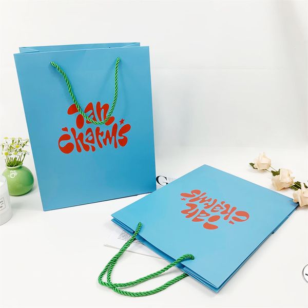 Venta al por mayor de zapatos azules de lujo, embalaje de ropa, bolsas de papel, bolsas de regalo de papel para compras de Boutique con logotipo