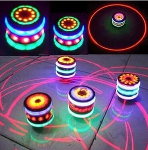 Venta al por mayor Magic Music Gyroscope Gyro Spinner Spinning Whirling Kids UFO Single Laser Colorful LED Peg-Top Toy Regalos de Navidad