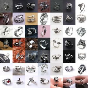 Hombres al por mayor Mujeres clásicas retro acero inoxidable Animal Dragon Dragon Feather Anillo ajustable Hip Hop Punk Jewellry Gifts Envío gratis