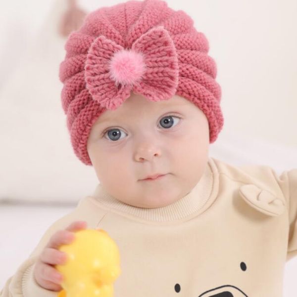 Venta al por mayor Bebé recién nacido Sombrero Infant Toddler Beanie Caps acrílico invierno sombreros de punto niños niñas diseñador cráneo gorras de punto bowknot pom poms gorros