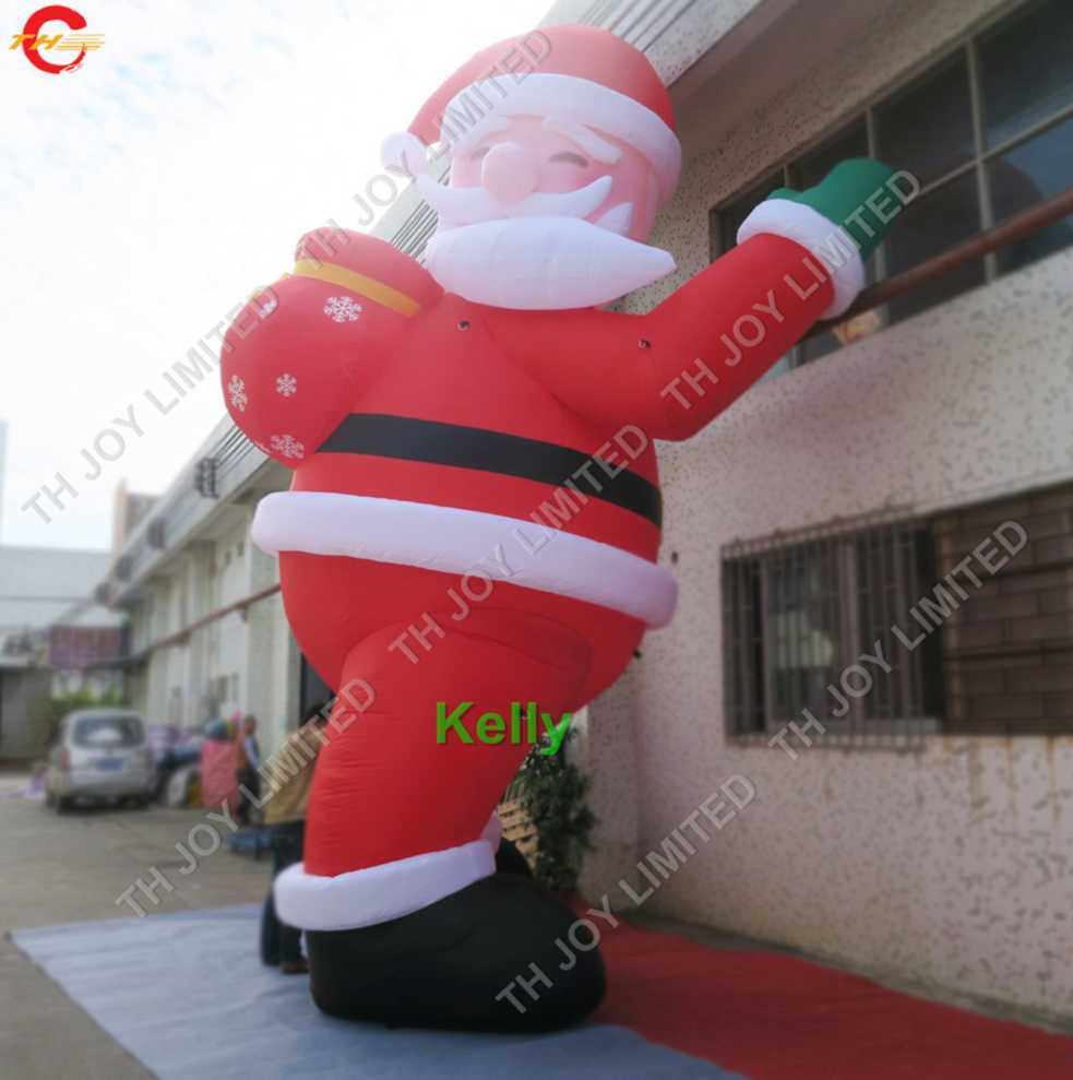 groothandel buitenactiviteiten gigantische opblaasbare kerstman met cadeauzakje Kerstluchtballon voor reclametekenfilms