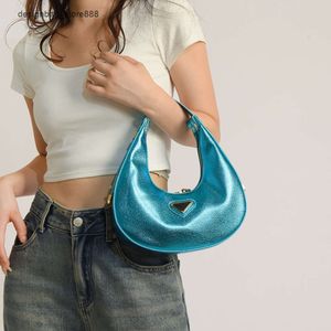 Groothandel retailmerk modehandtassen Nieuwe super hete mode-knoedeltas met glanzende Litchi-patroon Handtas Eenvoudige en gepersonaliseerde schoudertas