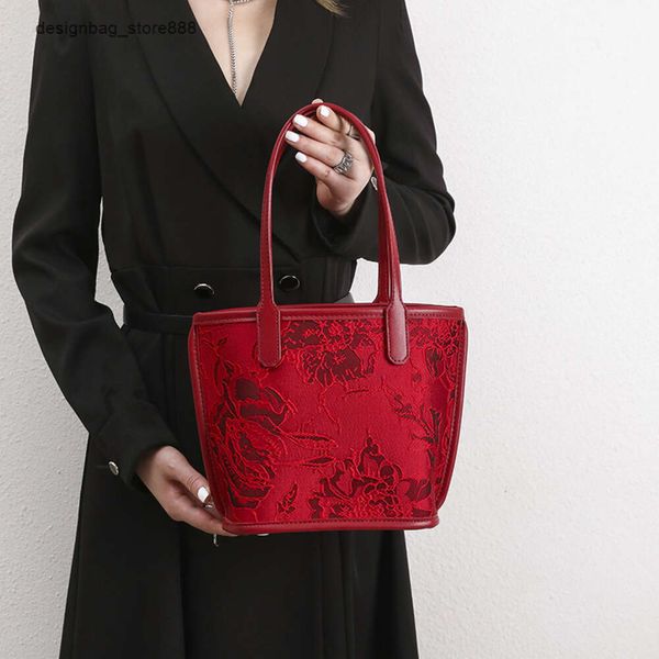 Venta al por mayor Marca al por menor Bolsos de moda Nuevo bolso de boda rojo de gama alta Gran capacidad Versátil Cesta de mano Axilas Luz Novia de lujo