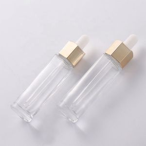 En gros, une bouteille en verre de forme hexagonale unique Perfume Perfume Bouteille de gouttes de sérum 30 ml avec couvercles de compte-gouttes en plastique blanc