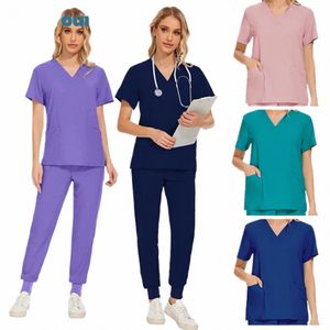 wholesale Les femmes portent des costumes de gommage hôpital médecin uniforme de travail médical chirurgical multicolore unisexe uniforme infirmière Accories U3KY #
