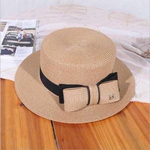 Brede rand hoeden Flat Top Big Bow Summer Sun Visor voor vrouwen mode m letter stro hoed elegante dames panama strand