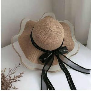 Brede rand hoeden handgemaakte dames zon hoed stro geweven panama big zwart en witte boog UV bescherming strandbescherming breed