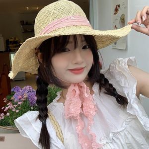 Sombreros anchos sombreros japoneses dulces tejidos a mano rosa streamer sombrero de paja Vacaciones de verano para mujeres Big Big Eaves Protection Cap