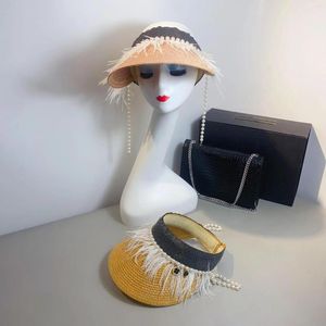 Brede rand hoeden niche design beroemdheden stijl veer parel ketting lege top hoed dames geavanceerd gevoel van elegantie reis zon schaduw zomer