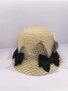 Chapeaux à bord large S202403-XUXU INS chic Summer Migne Mesh Bowknot Natural Raffia Grass Sunshade Lady Bucket Cap Women Hat de loisirs