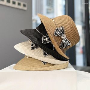 Chapeaux à bord large femmes Summer Sun Sun Hat élégant Royale Bow Hepburn Style Holiday Floppy Paille de Tempérament de Tempérament