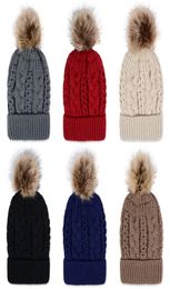Hiver épaisse double couche Colonceau de neige colorée chapeau de bonnet en tricot en laine avec raton laveur artificiel Pom Pom pour femmes hommes Hip Hop CA6771924